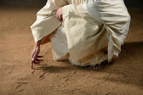 Jesus Writing In The Sand Stock Photos, Pictures & Royalty-Free Images ...