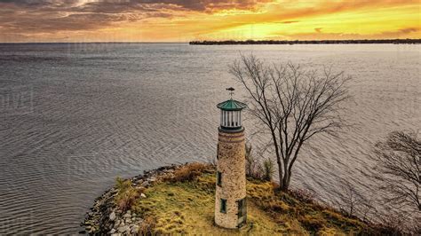 Romantic sunset over old lighthouse at public park. - Stock Photo ...