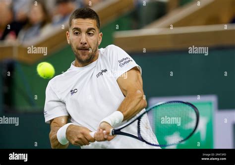 March 11, 2023 Thanasi Kokkinakis of Australia returns a shot against ...