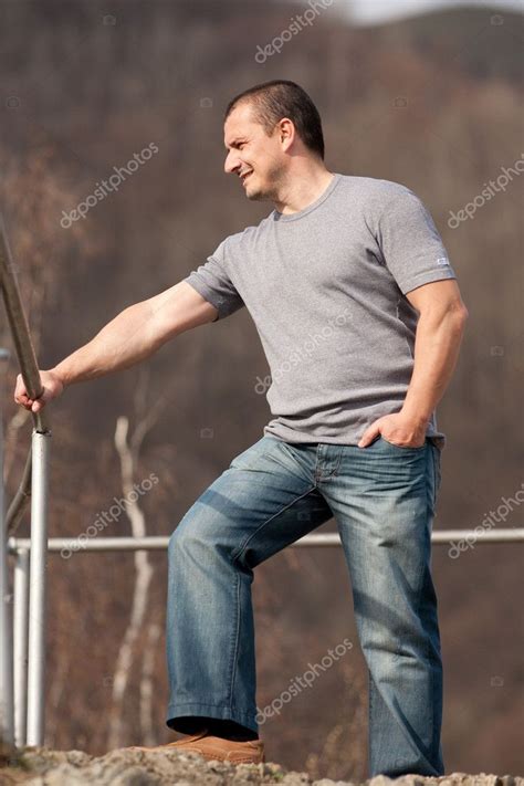 Young man full body portrait outdoors Stock Photo by ©Xalanx 2946844