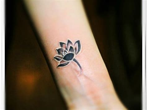 A Black And White Lotus Flower Tattoo On The Arm | Lotus flower tattoo ...