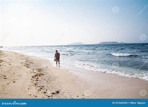 The Man is Walking Alone on the Beach Editorial Stock Image - Image of ...