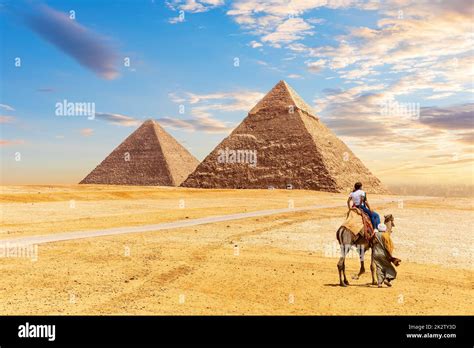 The Egypt Pyramids Khafre and Cheops and bedouin with tourists in the Giza desert Stock Photo ...