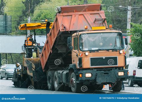 Team of Workers in Protective Uniforms Work on Road Construction. Road Works Stock Photo - Image ...