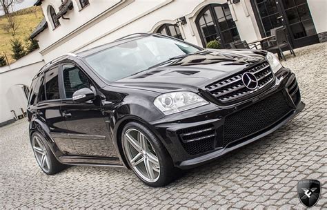 Black Mercedes MLX on Cobblestone Street