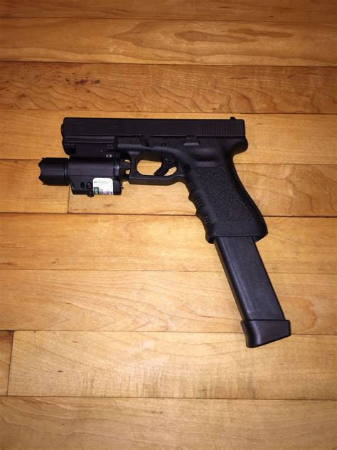 GLOCK G17 with tactical light and laser combo and 33 round extended mag | Guns | Pinterest ...