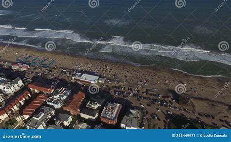 Aerial Scene with Beach Drones. Zoom in the Camera Moves Forward of the Beach with People in the ...