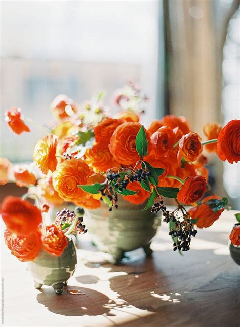 "Orange Floral Arrangement On Table" by Stocksy Contributor "Vicki ...