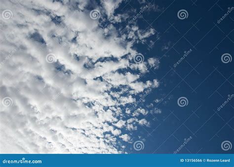 White Fluffy, Wind-blowing Clouds. Like Silver Clouds Royalty-Free ...