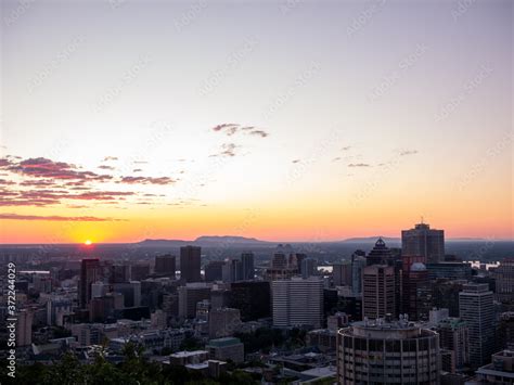 Montreal sunrise viewed from Mount Royal with city skyline in the ...