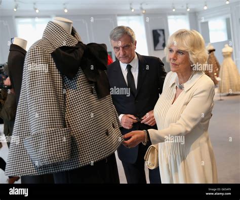 The Duchess of Cornwall looks at designer outfits during her visit of ...