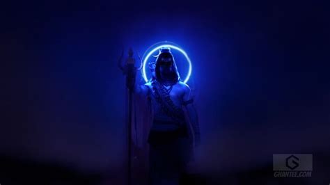 a woman standing in front of a blue light