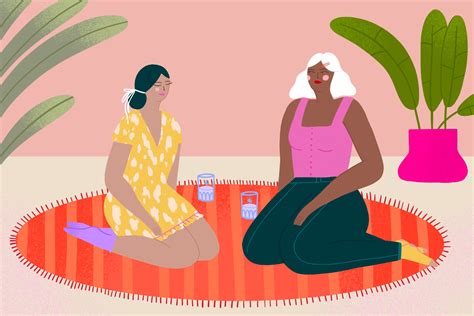 two women sitting on a rug talking to each other in front of a potted plant