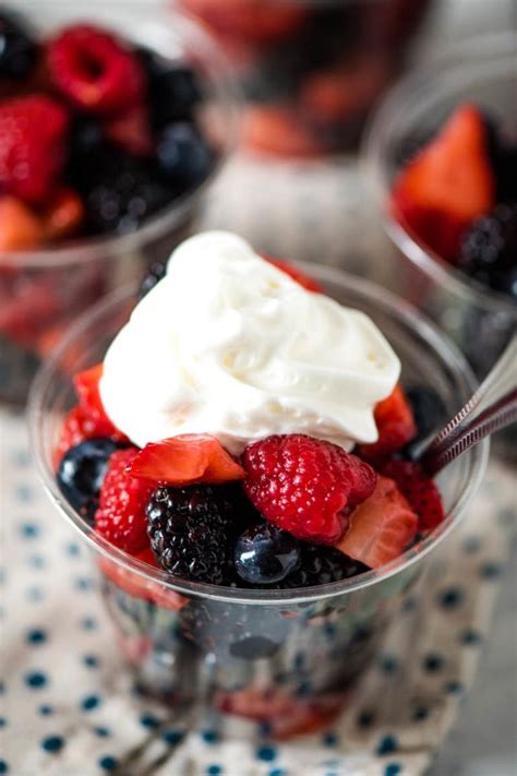 Make individual homemade fruit cups with fresh mixed berries topped with whipped cream. Easy ...