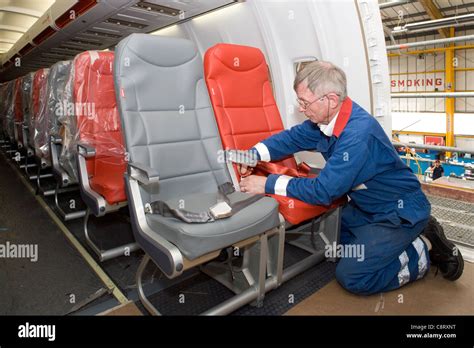 Boeing 757 cabin refurbishment fitting seat belts Stock Photo: 39863876 ...