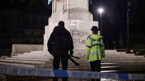 Rochdale cenotaph guarded by police after 'free Palestine' graffiti and poppy wreaths damaged ...