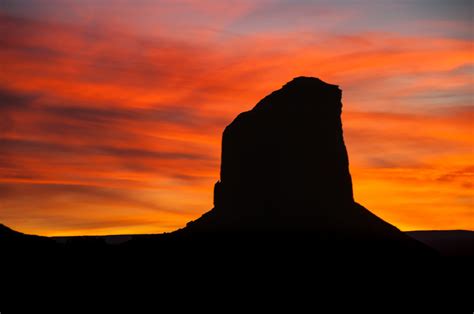 Silhouette of one of the buttes at Monument Valley Tribal Park, Arizona ...