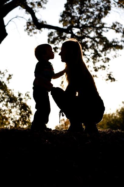 Silhouette Of The Two Little Kids Kissing Stock Photos, Pictures ...