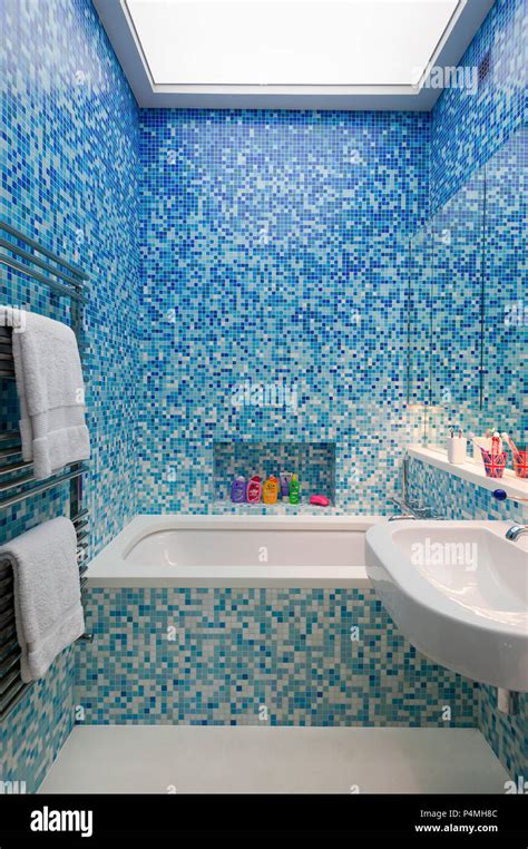 Blue tile work in modern bathroom Stock Photo - Alamy