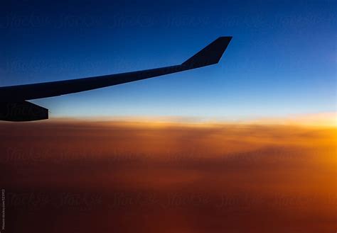 "Airplane Wing At Sunset" by Stocksy Contributor "Mosuno" - Stocksy