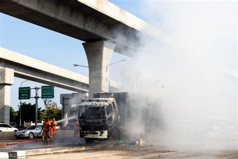 Fireman are Spraying on Fire of the Truck with Large Flames and ...