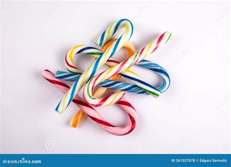 Different Colored Candy Canes in a Pile on a White Background Stock Photo - Image of decor ...