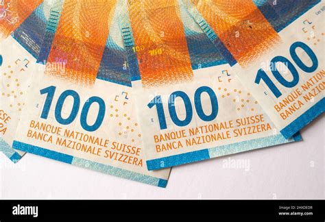 Fanned 100 Swiss Franc banknotes on a white background Stock Photo - Alamy