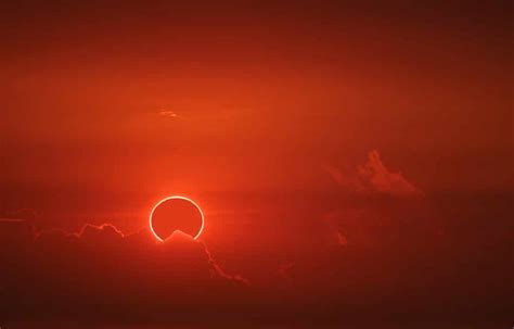 Incredible ‘red devil horns’ captured during rare solar eclipse mirage over the ocean