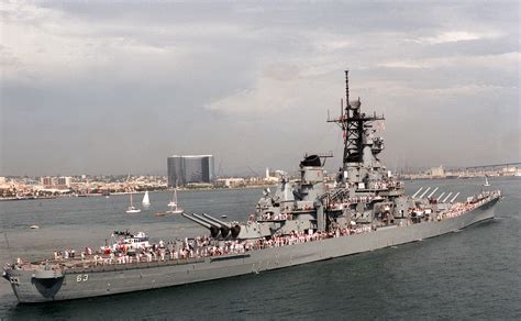 Tugs maneuver the battleship USS MISSOURI (BB-63) into a berth at the ...