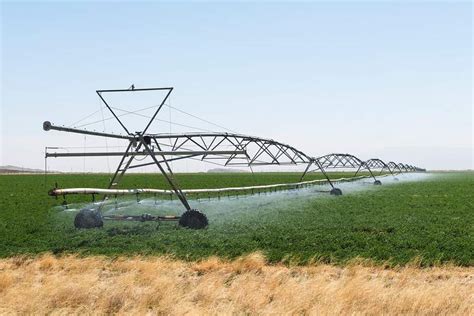 Rolling irrigation sprinkler at work | Free Photo - rawpixel