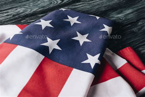 folded united states national flag on grey wooden surface, memorial day concept Stock Photo by ...