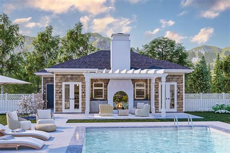 This is a quaint cottage-style poolhouse, exuding an aura of rustic charm and coziness. The ...