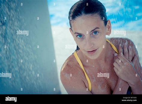 Young woman under blue hi-res stock photography and images - Alamy