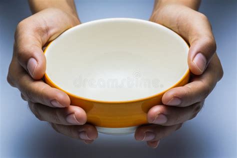 A Hungry Female Holding an Empty Bowl. Stock Photo - Image of neglected ...