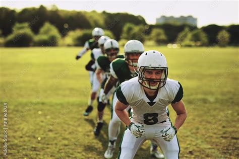 American football team doing drills on a sports field Stock Photo ...