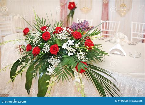 Beautiful Bouquet of Rose Flowers on Table. Wedding Bouquet of Red Roses. Elegant Wedding ...