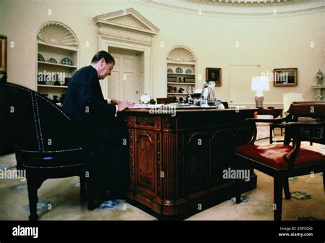 President Ronald Reagan working at the Resolute Desk ion the Oval Office in 1985. This was an ...