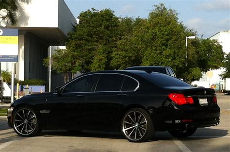 Exotic Cars on the Streets of Miami: Black BMW 750i with custom Vossen rims