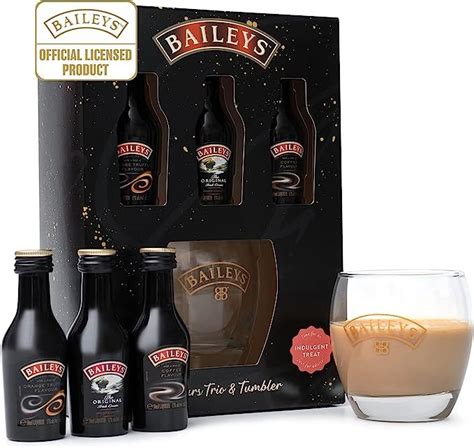 an assortment of bailey's drinks in front of a box and glass filled ...