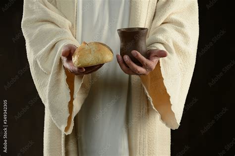 Jesus holding the bread and the wine Stock Photo | Adobe Stock