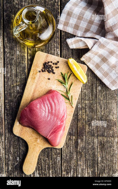 Fresh raw tuna steak on cutting board Stock Photo - Alamy