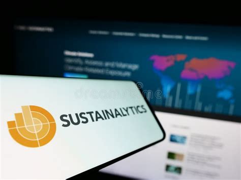 Cellphone with Logo of ESG Rating Company Sustainalytics on Screen in Front of Business Website ...