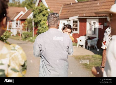 Father carrying baby Stock Photo - Alamy