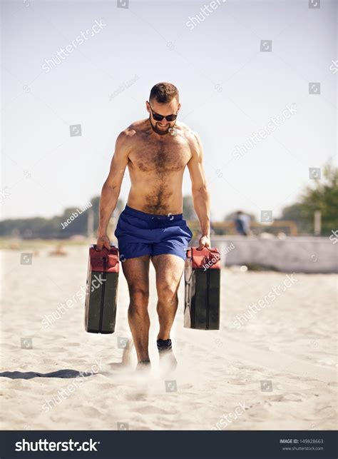 Man Doing Workout On Beach Jerrycans Stock Photo 149828663 | Shutterstock