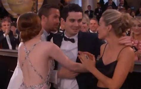 Watch Emma Stone's awkward three-way hug at the Golden Globes - NME