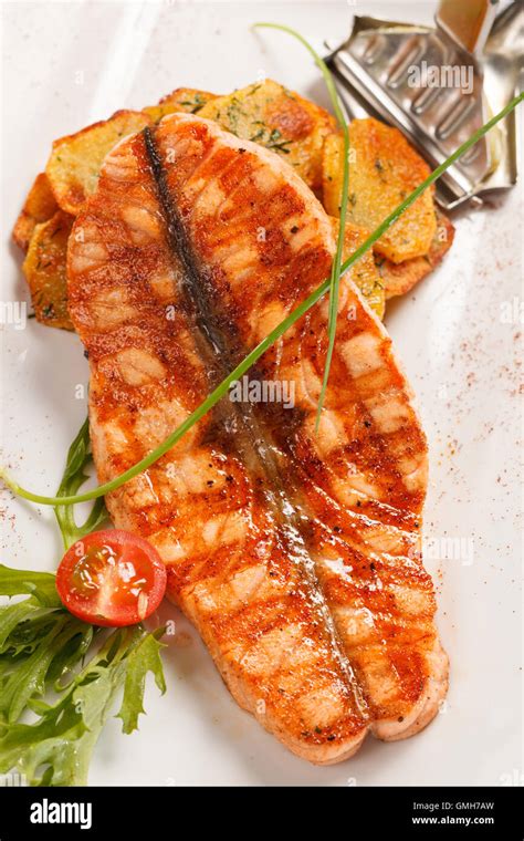 salmon steak with potatoes Stock Photo - Alamy