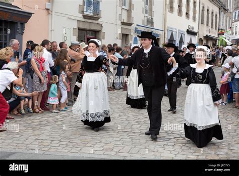 Brittany France - adults in traditional costume parading in the streets of Pont l'Abbe for the ...