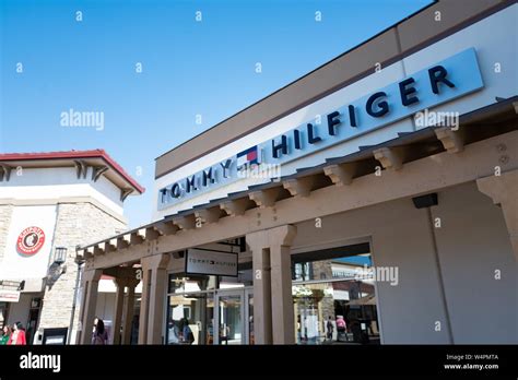 Facade with logo at Tommy Hilfiger outlet store in the San Francisco ...