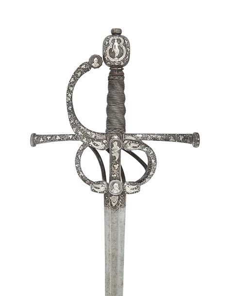 A FINE SWEPT-HILT RAPIER WITH SILVER-INLAID ORNAMENT , IN GERMAN 16TH CENTURY STYLE | Christie's