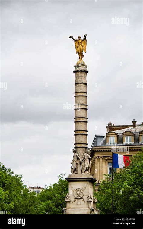 Close view of a tower with a golden statue on the top located in Paris, France Stock Photo - Alamy